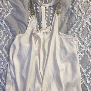 Silk blouse with rhinestone detail.